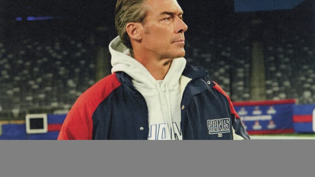 Jason Sehorn models New York Giants apparel.